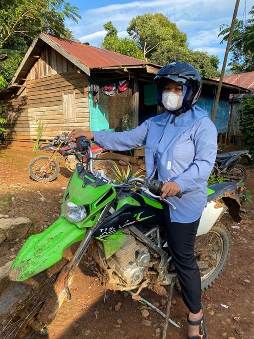 Eva, a village midwife, on her off-road bike.